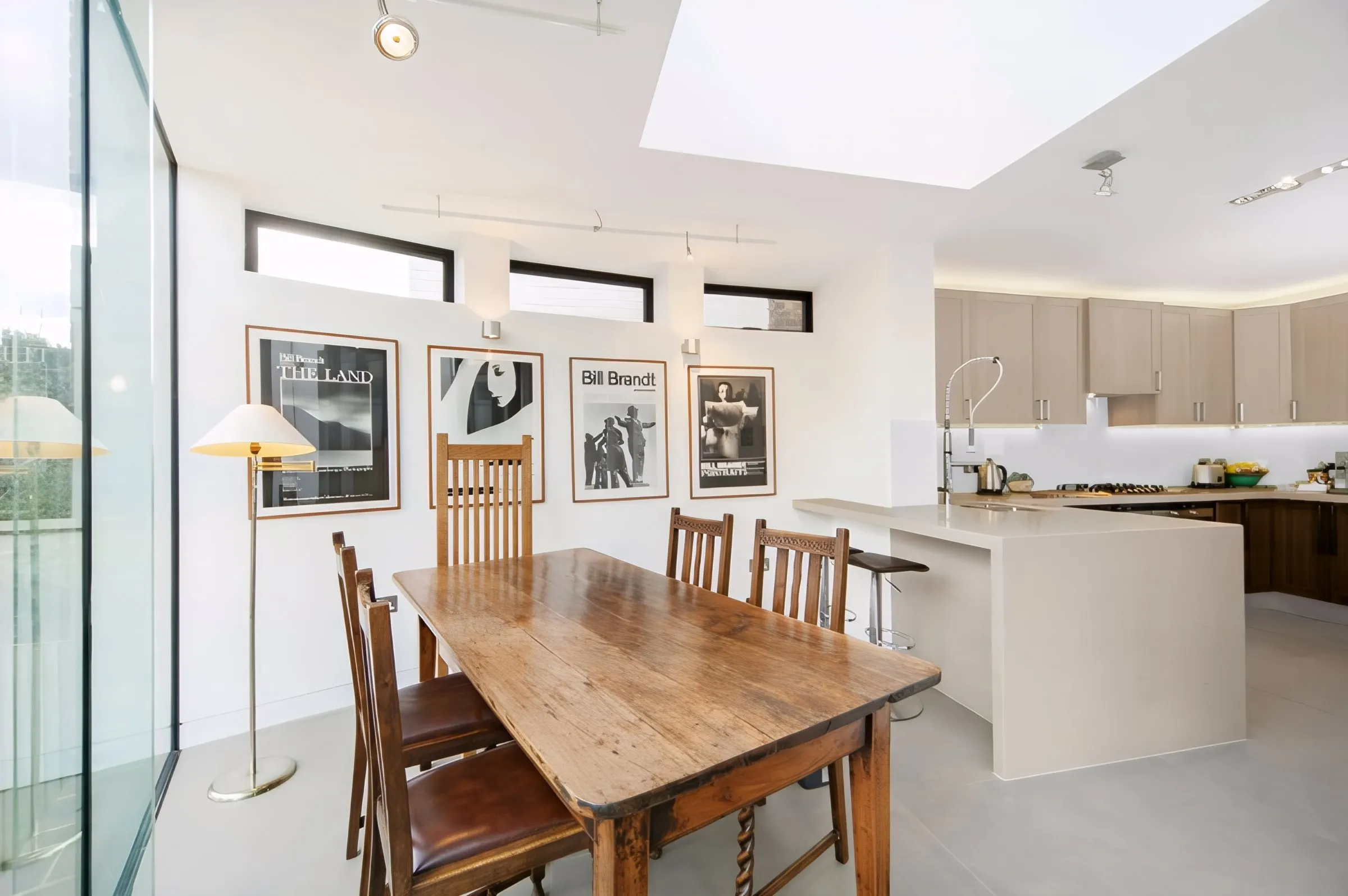 Kitchen and dining space under a large rooflight