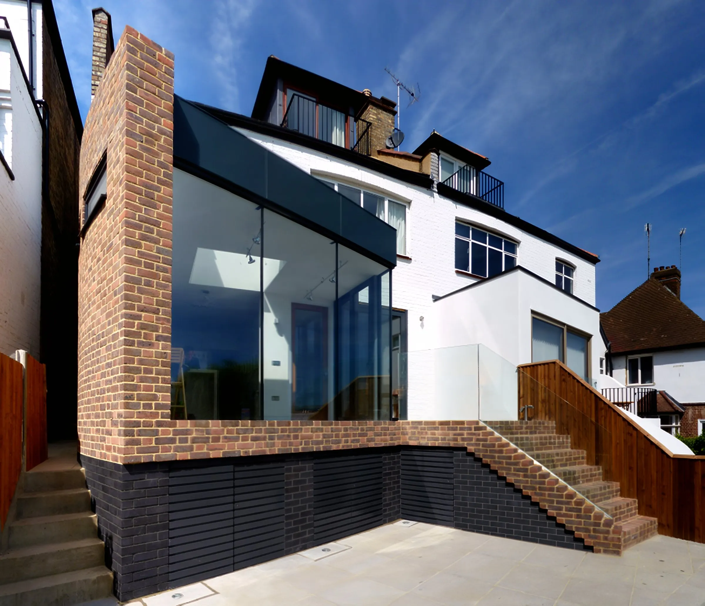 The extension seen from the lower garden, with brick steps