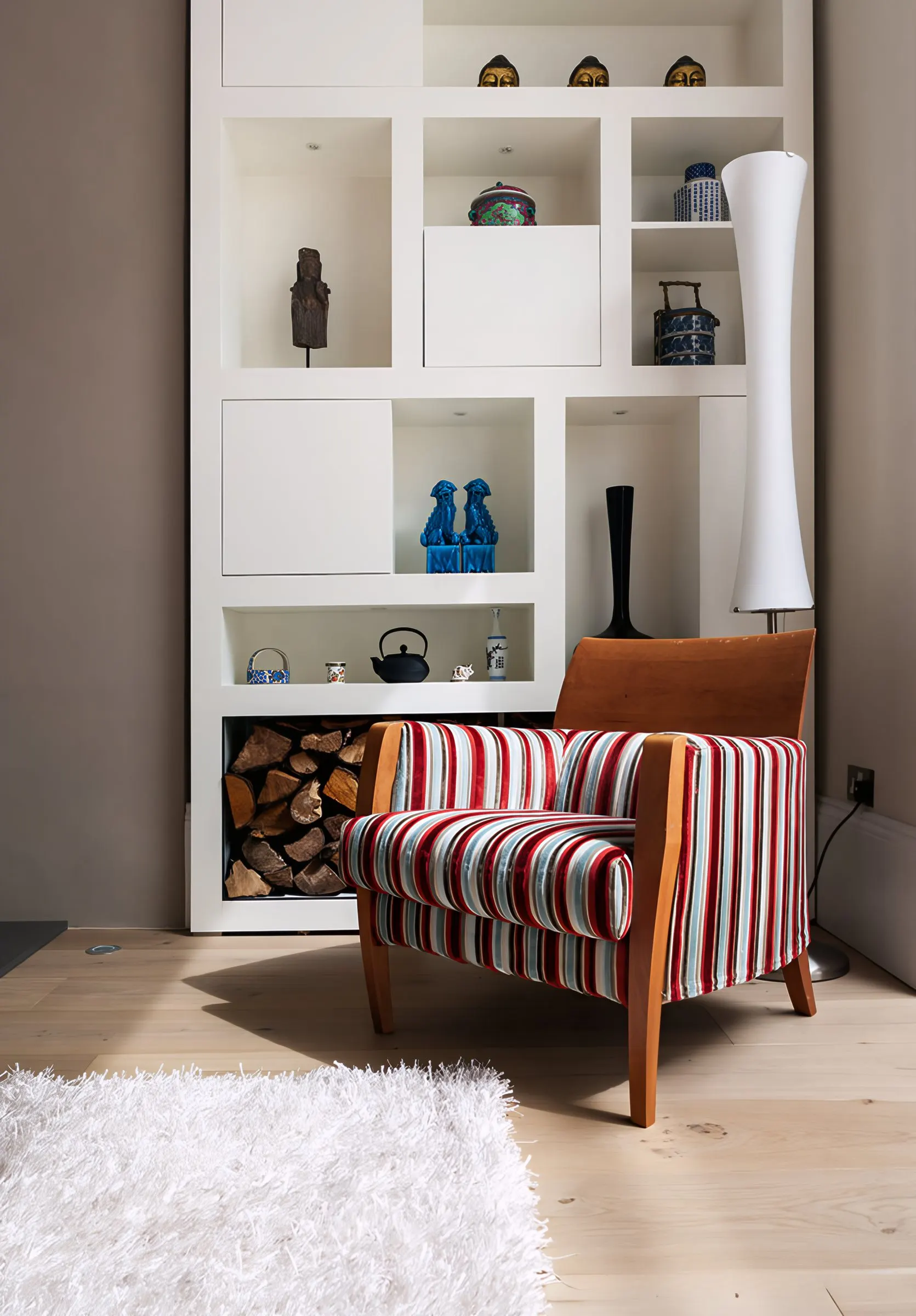 Built-in shelving and log store in the living room