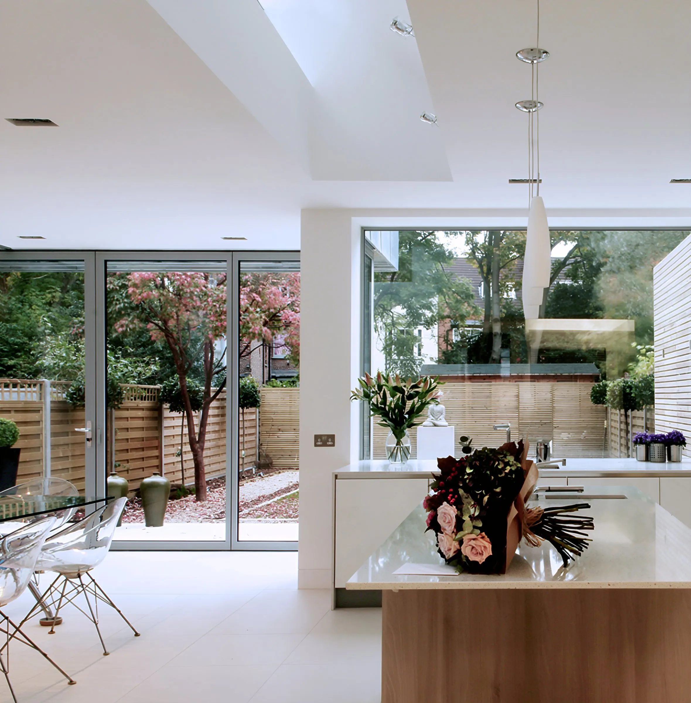 Kitchen island framed by garden views
