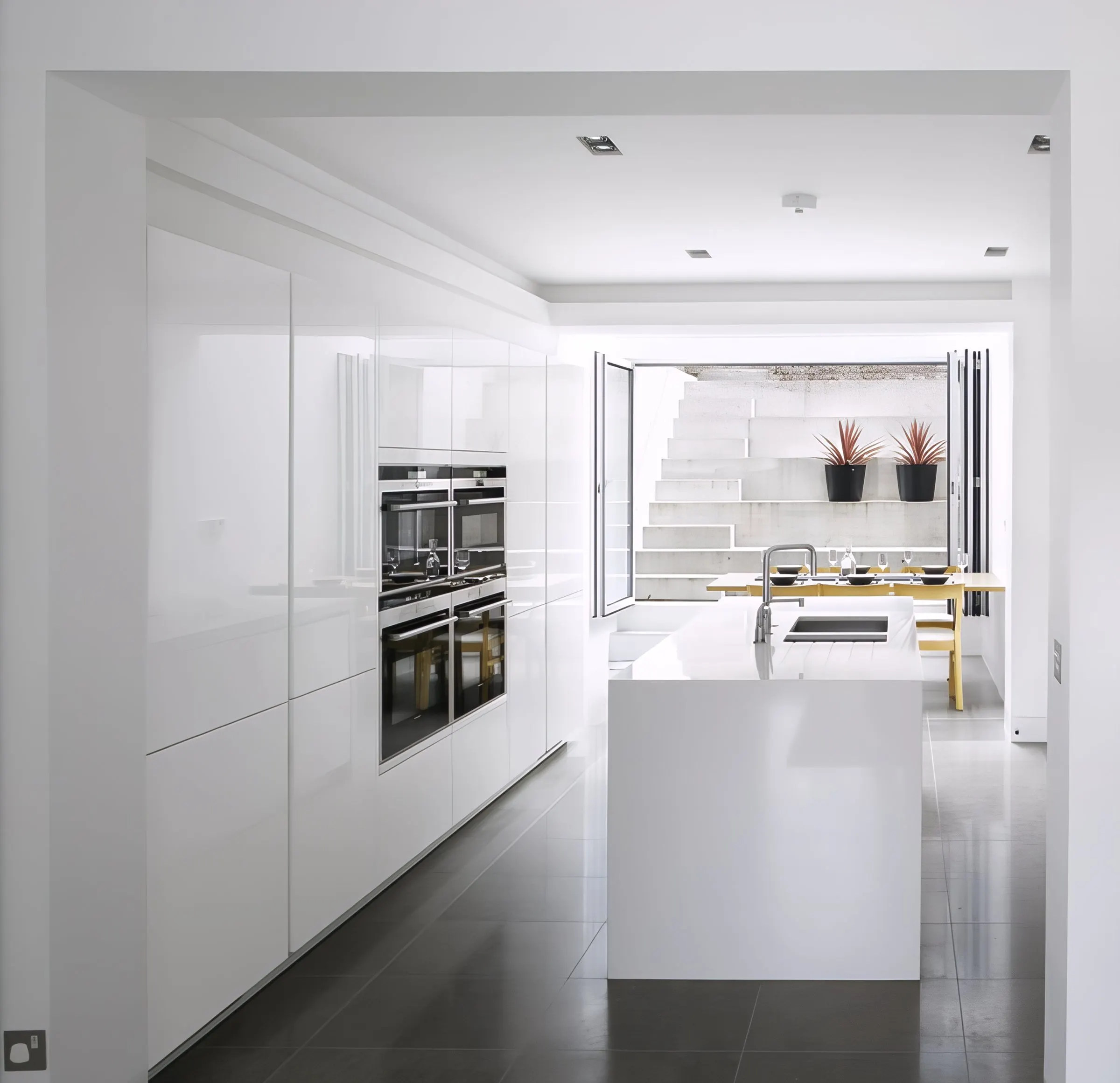Kitchen and dining space with the stepped garden beyond
