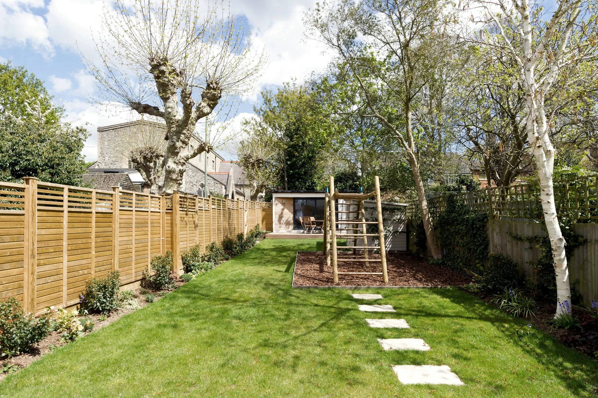 Rear garden with stepping stones leading to the extension