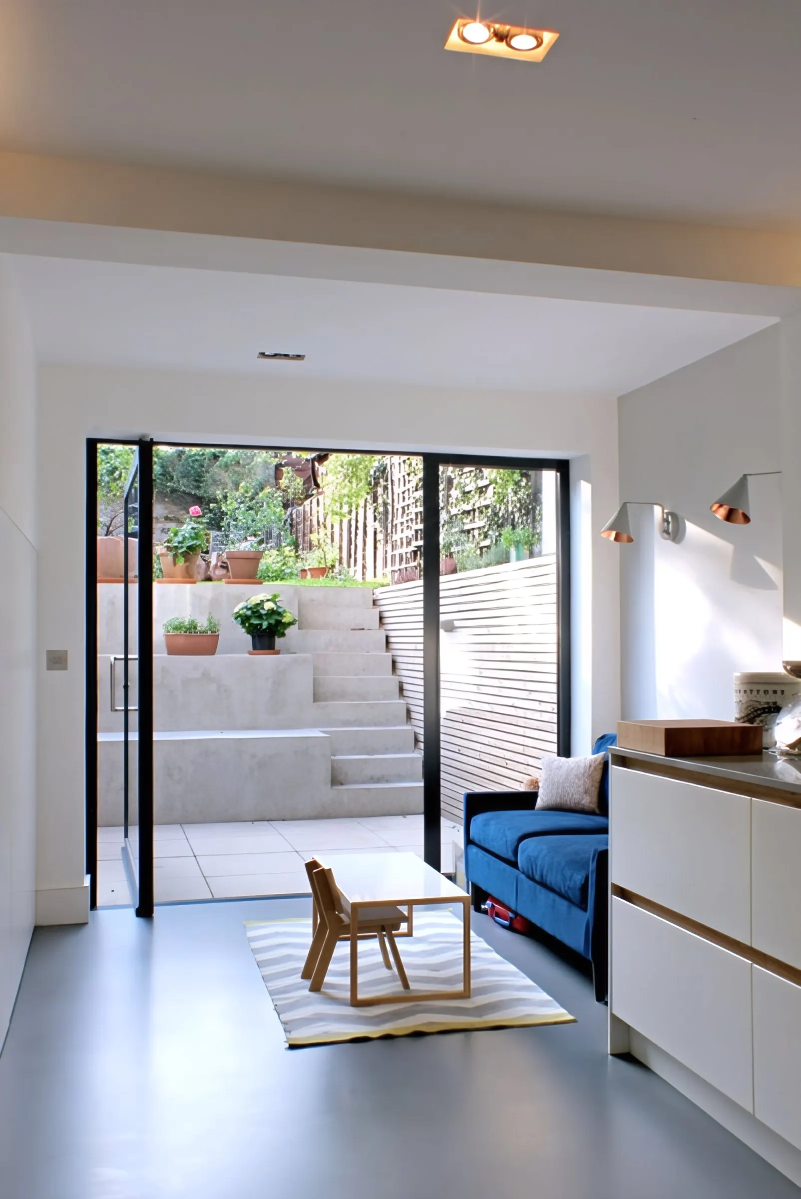 Kitchen opening onto the sunken rear courtyard