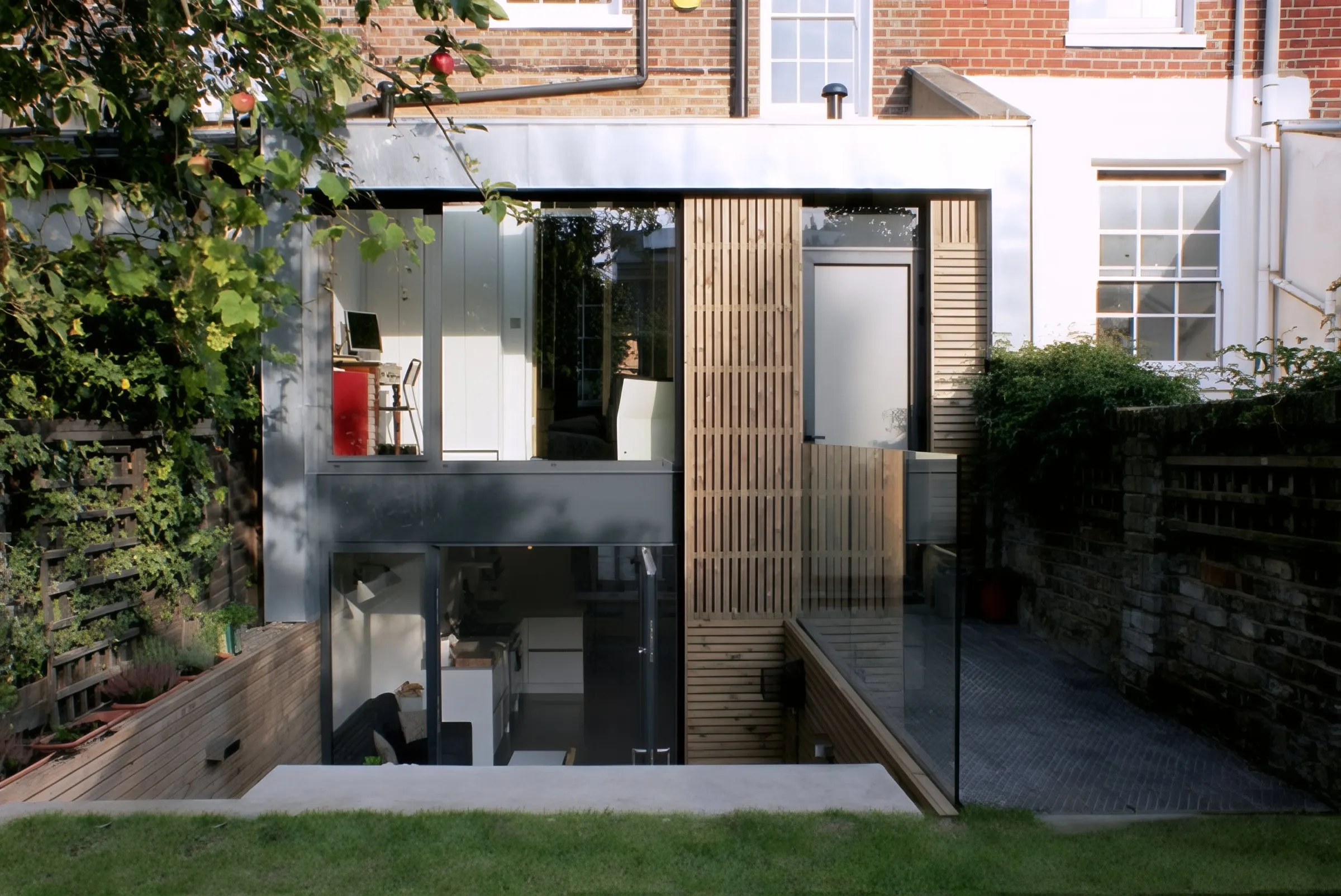 Remodelled rear façade with new glazing and timber panels