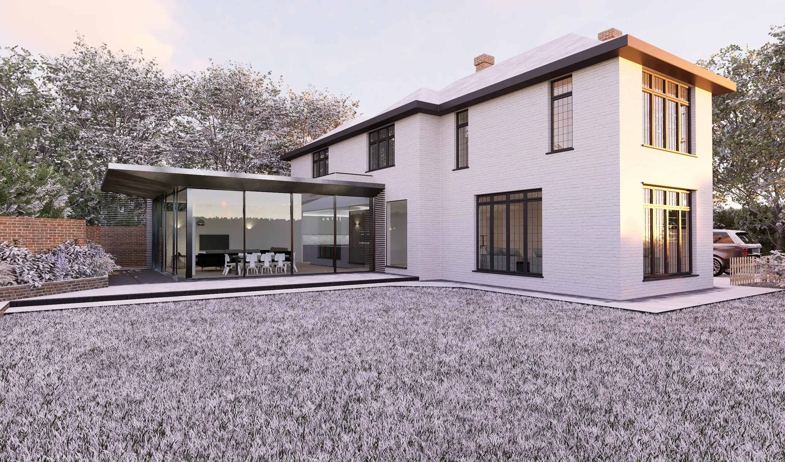 Side view of the house and extension from a gravel garden path
