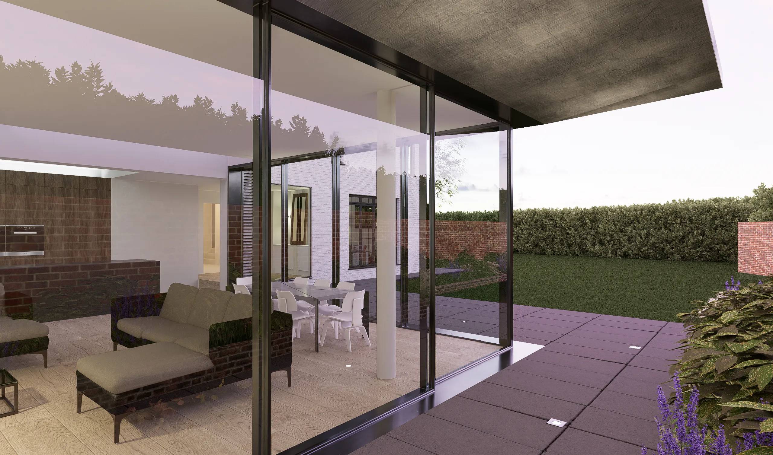 Seating area inside the extension with brick wall and glazed corner